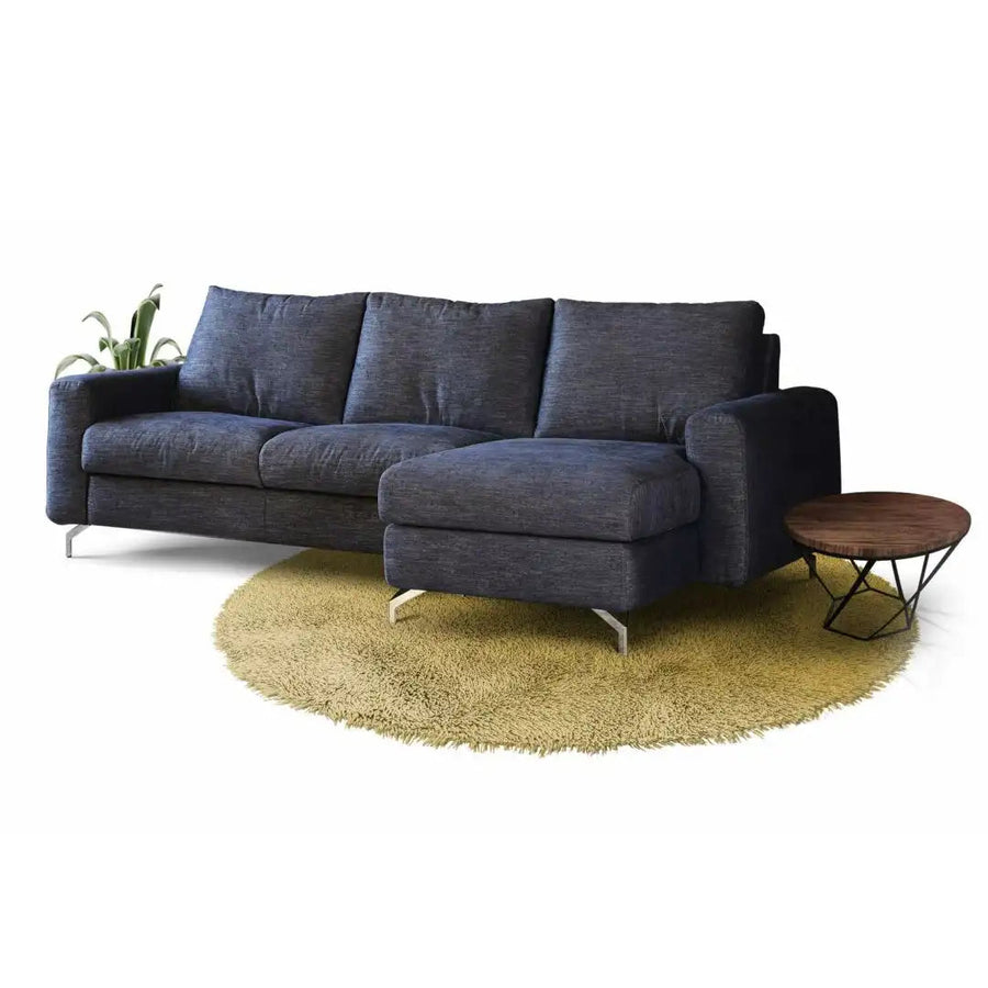 Slumbersofa Embrace - Side view of a three seater navy blue sofa bed with chaise, feather padding and removable cover, featuring a pair of 22cm sofa arms and a closed king size mattress | Spaceman space saving furniture, Singapore.
